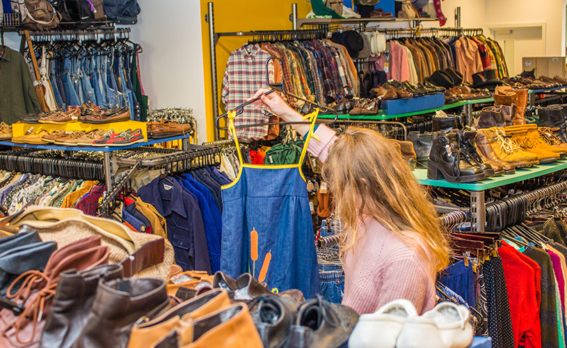 Shopper looking at clothes in Beyond Retro